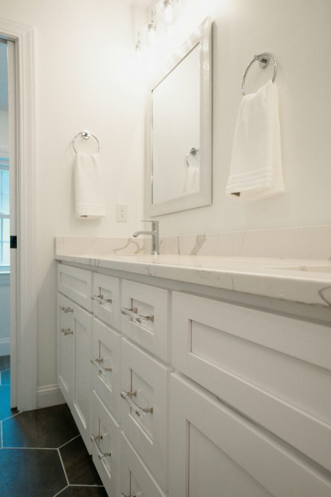 Professional real estate photography of modern bathroom with double sink